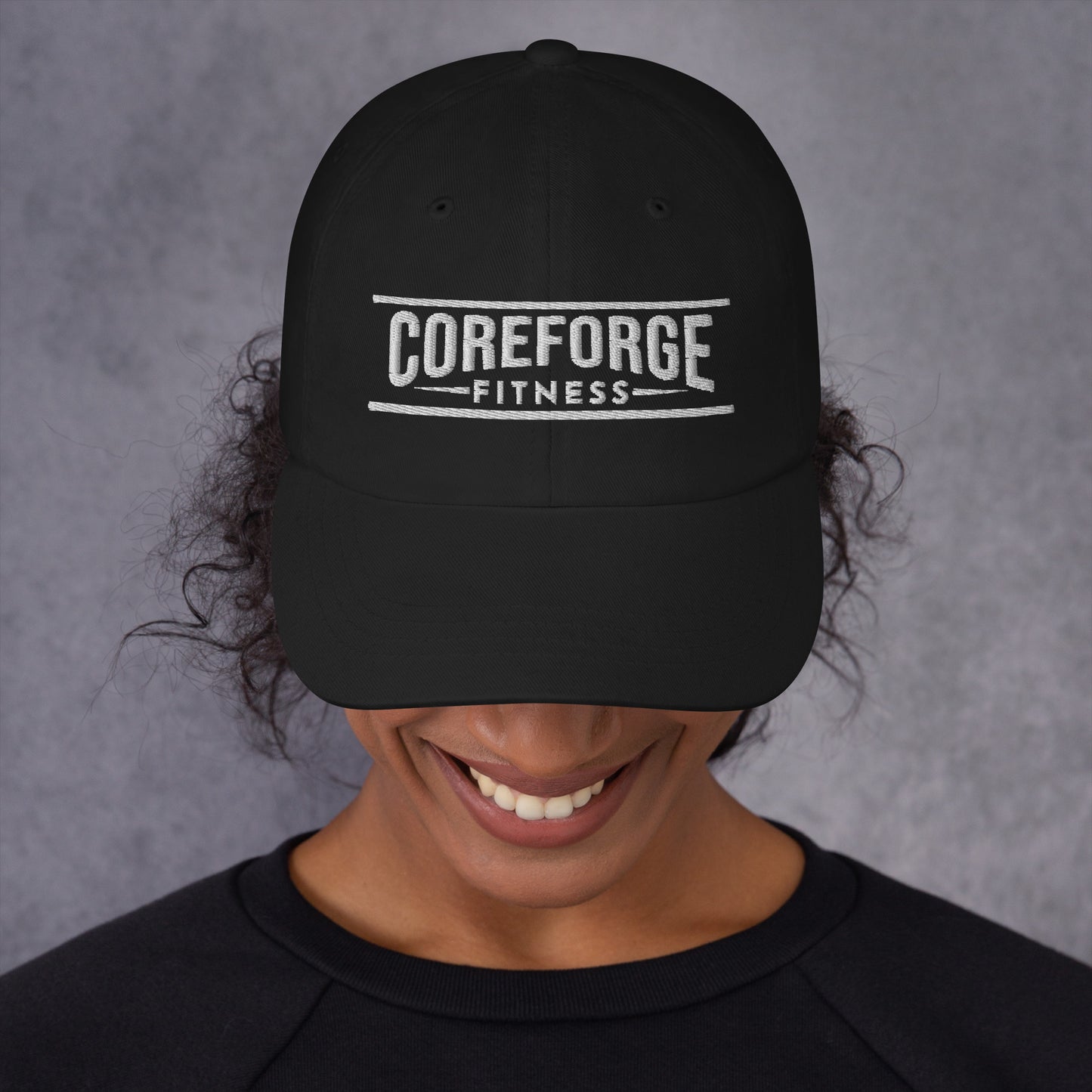Black baseball cap with CoreForge Fitness logo embroidered on it - Front